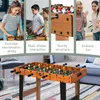 A collage of images showing children and adults playing with a foosball table, and a close-up of the foosball table itself. Voir les images du produit