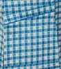 A close-up view of a blue and white checkered fabric, likely part of a garment. Produktbild-Vorschau