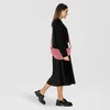 A woman walking with a bag. Anteprima dell’immagine prodotto