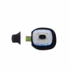 A black silicone suction cup is placed to the left of a small, white and blue LED light with a green connector. Produktbild-Vorschau