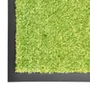 A close-up view of a green carpet with a black border. Voir les images du produit