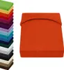A stack of colorful fitted sheets and a single orange fitted sheet. Produktbild-Vorschau