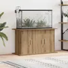 An aquarium with fish on a wooden stand in a room. Náhled obrázku produktu