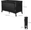A black travel crib is shown in its unfolded and folded states, with dimensions indicated by text overlays. Voir les images du produit