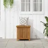 A wooden storage box with a decorative pillow on top, placed on a patio in front of a white wooden wall and a window. Náhľad obrázku produktu