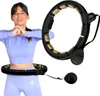 A woman is shown wearing a fitness hoop around her waist, and a separate image of the hoop is displayed. Náhled obrázku produktu