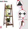 A wooden plant stand with decorative items and informational graphics on the side. Produktbild-Vorschau