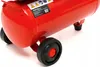 A close-up view of the bottom section of a red air compressor, showing its wheels and a label. Náhľad obrázku produktu