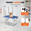 A dog grooming table with a small dog on it, with text overlays highlighting features. Anteprima dell’immagine prodotto