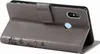 A gray flip case for a smartphone is shown from the side, with the front cover open and folded back. Produktbild-Vorschau
