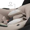 Close-up view of the interior of a beige baby car seat, highlighting the padding and straps. Produktbild-Vorschau