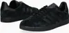 A pair of black Adidas Gazelle sneakers shown from a slightly elevated side angle against a white background. Voir les images du produit