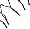 Close-up of a string of LED lights with black wires and white LED bulbs. Produktbild-Vorschau