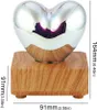 A heart-shaped glass lamp with a wooden base, shown with dimensions. Produktbild-Vorschau