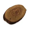 A close-up, top-down view of a rustic olive wood serving board with a natural bark edge, presented on a white background. Produktbild-Vorschau