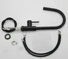 A black kitchen faucet and its accessories laid out on a white background. Produktbild-Vorschau