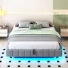 A modern bedroom with a bed featuring LED lighting. Náhled obrázku produktu