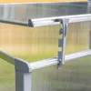 A close-up view of a greenhouse corner with a plastic clip holding the panels together. Anteprima dell’immagine prodotto