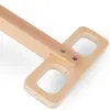 A close-up view of a wooden toy wagon handle. Produktbild-Vorschau