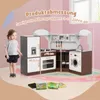 A child stands next to a wooden play kitchen with various dimensions labeled. Anteprima dell’immagine prodotto