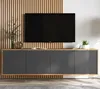 A modern TV stand with a dark gray front and a wooden frame, mounted below a black flat-screen television against a slatted wooden wall. Produktbild-Vorschau