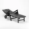 A black plastic sun lounger on a white background. Produktbild-Vorschau