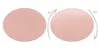 Two round pink mats are shown side-by-side. The mat on the right has arrows indicating a 180-degree rotation. Produktbild-Vorschau