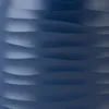A close-up view of a navy blue carafe with a wavy, textured surface. Voir les images du produit
