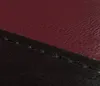 A close-up view of the stitching and texture of two different colored materials, likely leather or faux leather, joined together. Náhľad obrázku produktu