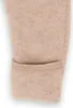 A close-up view of the cuff of a beige baby overall. Produktbild-Vorschau