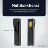 Two views of a black mini work light are shown, with labels pointing out its features. Náhled obrázku produktu
