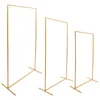 Three gold metal stands of varying heights against a white background. Produktbild-Vorschau