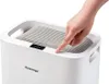 A hand is shown pressing a button on a white air purifier. Anteprima dell’immagine prodotto