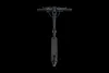 A black electric scooter shown from a top-down perspective against a black background. Produktbild-Vorschau