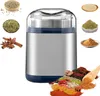 A spice grinder surrounded by various spices and herbs. Produktbild-Vorschau