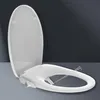 A white bidet toilet seat with the lid open, showing water spraying from the nozzles. Anteprima dell’immagine prodotto