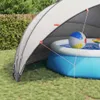 A pool dome set up over an inflatable pool in a backyard. Anteprima dell’immagine prodotto