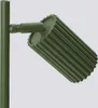 A close-up, studio shot of a green lamp. Voir les images du produit
