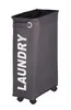 A tall, narrow, dark gray laundry hamper with wheels and the word "LAUNDRY" printed vertically in white on the front. Náhľad obrázku produktu