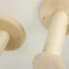 A close-up view of two beige cat climbing structures, showing the sisal rope and plush fabric. Náhled obrázku produktu
