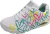 A white Skechers sneaker with a colorful heart print. Produktbild-Vorschau