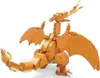 A constructed toy dragon figure with its mouth open, emitting flames. Voir les images du produit