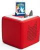 A red Toniebox audio player with a book-shaped Tonie on top. Produktbild-Vorschau
