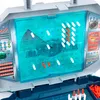 A close-up view of a Battleship board game, showing the game board with pegs and ships. Produktbild-Vorschau