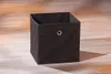 Faltbox WINNY in Schwarz, Gesamtansicht mit offenem oberen Rand und Metallöse, auf Holzboden. Produktbild-Vorschau