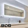 A modern bathroom vanity with a large LED mirror, two sinks, and faucets. Produktbild-Vorschau