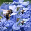 A close-up of blue flowers with a bee, with inset images demonstrating camera focus modes. Produktbild-Vorschau