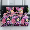 A bed with a floral patterned duvet and pillows.