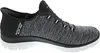 A side view of a single black and gray Skechers slip-on shoe. Podgląd zdjęcia produktu