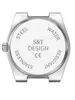 The back of a watch case with text and markings. Voir les images du produit